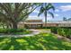 Clubhouse view with greenery and landscaping at 4440 Fairways Blvd # 210, Bradenton, FL 34209