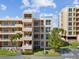 Exterior shot of condo buildings featuring multiple balconies, landscaping and accessible parking at 4440 Fairways Blvd # 210, Bradenton, FL 34209