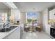 Cozy kitchen with dining nook and stainless steel appliances, perfect for casual meals at 4440 Fairways Blvd # 210, Bradenton, FL 34209