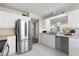 Well-lit kitchen showcasing stainless steel appliances, white cabinets, and undermount sink at 4440 Fairways Blvd # 210, Bradenton, FL 34209