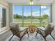 Relaxing lanai with comfortable seating, golf course view and plenty of natural light at 4440 Fairways Blvd # 210, Bradenton, FL 34209