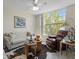 Cozy living room with large window, plush seating, and unique decor at 4440 Fairways Blvd # 210, Bradenton, FL 34209
