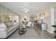 Comfortable living room with mirrored wall, open layout, and stylish furnishings for relaxed living at 4440 Fairways Blvd # 210, Bradenton, FL 34209
