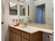 Functional bathroom with a wide mirror, spacious vanity, and ample storage for everyday essentials at 4944 Village Gardens Dr # 151, Sarasota, FL 34234