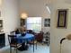 Dining room with a round table and sliding glass door views of the patio at 4944 Village Gardens Dr # 151, Sarasota, FL 34234