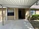 Front view of a charming home with a carport, perfect for easy parking and weather protection at 4944 Village Gardens Dr # 151, Sarasota, FL 34234