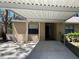 Tan house with a carport and a neatly maintained front yard showcasing curb appeal at 4944 Village Gardens Dr # 151, Sarasota, FL 34234