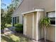 Exterior view featuring a convenient storage shed and lush tropical landscaping at 4944 Village Gardens Dr # 151, Sarasota, FL 34234