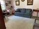 Cozy living room featuring neutral carpet, and furnishings including a sofa, tables, and wall art at 4944 Village Gardens Dr # 151, Sarasota, FL 34234