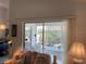 Living room with sliding glass door access to the lanai and lots of natural light at 4944 Village Gardens Dr # 151, Sarasota, FL 34234