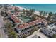 Scenic aerial shot of beachfront condo community near tennis courts and pristine beach at 5055 Gulf Of Mexico Dr # 422, Longboat Key, FL 34228
