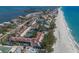 Scenic aerial view showcases the neighborhood, beach, and nearby ocean at 5055 Gulf Of Mexico Dr # 422, Longboat Key, FL 34228