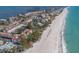 An aerial view of the condos along the beach, with tennis courts available for recreation at 5055 Gulf Of Mexico Dr # 422, Longboat Key, FL 34228