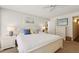 Inviting bedroom featuring a comfortable bed and ample natural light at 5055 Gulf Of Mexico Dr # 422, Longboat Key, FL 34228