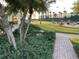 Serene community area with manicured landscaping and a path to the common area at 5055 Gulf Of Mexico Dr # 422, Longboat Key, FL 34228