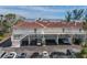 Condominium exterior featuring covered parking, balconies, and well-maintained landscaping at 5055 Gulf Of Mexico Dr # 422, Longboat Key, FL 34228