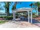 Community gazebo with seating and lush landscaping, providing a relaxing outdoor space at 5055 Gulf Of Mexico Dr # 422, Longboat Key, FL 34228