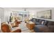 Cozy living room features a comfortable sectional, stylish accent chairs, and access to the balcony at 5055 Gulf Of Mexico Dr # 422, Longboat Key, FL 34228