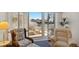 Well-lit living room with shutters and access to the balcony, perfect for enjoying outdoor views at 5055 Gulf Of Mexico Dr # 422, Longboat Key, FL 34228