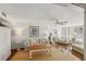 Bright living room with hardwood floors, ceiling fan and comfortable furniture and art at 5055 Gulf Of Mexico Dr # 422, Longboat Key, FL 34228