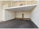 Under-building parking area, with three storage units and a stairwell at 5055 Gulf Of Mexico Dr # 422, Longboat Key, FL 34228