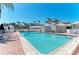 Refreshing community pool with lounge chairs, cabana, and well-kept surroundings at 5055 Gulf Of Mexico Dr # 422, Longboat Key, FL 34228
