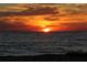 A scenic view of the sun setting over the ocean in the distance at 5055 Gulf Of Mexico Dr # 422, Longboat Key, FL 34228