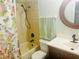 Cozy bathroom with a shower and tub combo featuring a stylish floral shower curtain at 5061 Barrington Cir # 1302, Sarasota, FL 34234
