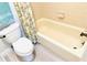 Bathroom with tile bathtub and toilet at 5061 Barrington Cir # 1302, Sarasota, FL 34234