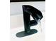 Close-up of black waterfall bathroom faucet with running water at 5061 Barrington Cir # 1302, Sarasota, FL 34234