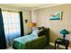 Guest bedroom with unique wall trim and furnishings at 5061 Barrington Cir # 1302, Sarasota, FL 34234