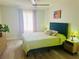 Inviting bedroom with a comfortable bed, side tables and a brightly lit window at 5061 Barrington Cir # 1302, Sarasota, FL 34234
