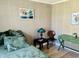 Guest bedroom with unique wall trim and furnishings at 5061 Barrington Cir # 1302, Sarasota, FL 34234