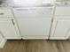 Kitchen featuring white dishwasher and classic cabinets with hardware at 5061 Barrington Cir # 1302, Sarasota, FL 34234