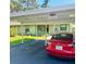 Charming home with a carport, lush lawn, and landscaped front yard with curb appeal at 5061 Barrington Cir # 1302, Sarasota, FL 34234