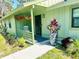 Charming home entrance with a cozy porch, decorative plants, and a well-maintained walkway at 5061 Barrington Cir # 1302, Sarasota, FL 34234