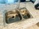 Stainless steel double sink with updated faucet, granite countertop, in modern kitchen at 5061 Barrington Cir # 1302, Sarasota, FL 34234