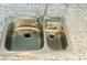 Newer stainless steel double sink and single-handle faucet are featured in the kitchen at 5061 Barrington Cir # 1302, Sarasota, FL 34234