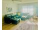 Bright living room showcasing an oversized sectional, fan and decor at 5061 Barrington Cir # 1302, Sarasota, FL 34234