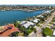 Aerial shot of beautiful waterfront home with lush landscaping, private dock, and amazing water views in a desirable location at 527 Key Royale Dr, Holmes Beach, FL 34217
