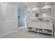 Bright white bathroom with double vanity at 527 Key Royale Dr, Holmes Beach, FL 34217