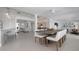 Open concept dining area with an expansive view of the living room and kitchen, enhancing the home's flow at 527 Key Royale Dr, Holmes Beach, FL 34217