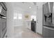 Bright white kitchen with stainless steel appliances and beverage center at 527 Key Royale Dr, Holmes Beach, FL 34217