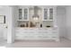 Bright kitchen featuring white cabinets, tiled backsplash, and modern finishes at 527 Key Royale Dr, Holmes Beach, FL 34217