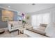 Bright living room featuring neutral colors, modern decor and large windows for natural light at 527 Key Royale Dr, Holmes Beach, FL 34217