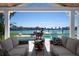 Relax on your covered patio, with waterfront views and a custom pool at 527 Key Royale Dr, Holmes Beach, FL 34217