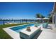 Pool with integrated spa featuring waterfront views in this outdoor oasis at 527 Key Royale Dr, Holmes Beach, FL 34217