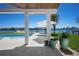 Tranquil waterfront view from the outdoor patio and sparkling swimming pool at 527 Key Royale Dr, Holmes Beach, FL 34217