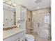 This bathroom features a glass enclosed shower, with tile surround, and a granite topped vanity at 5300 Ocean Blvd # 202, Sarasota, FL 34242