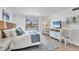 Bright bedroom with balcony access and a view of the coast at 5300 Ocean Blvd # 202, Sarasota, FL 34242